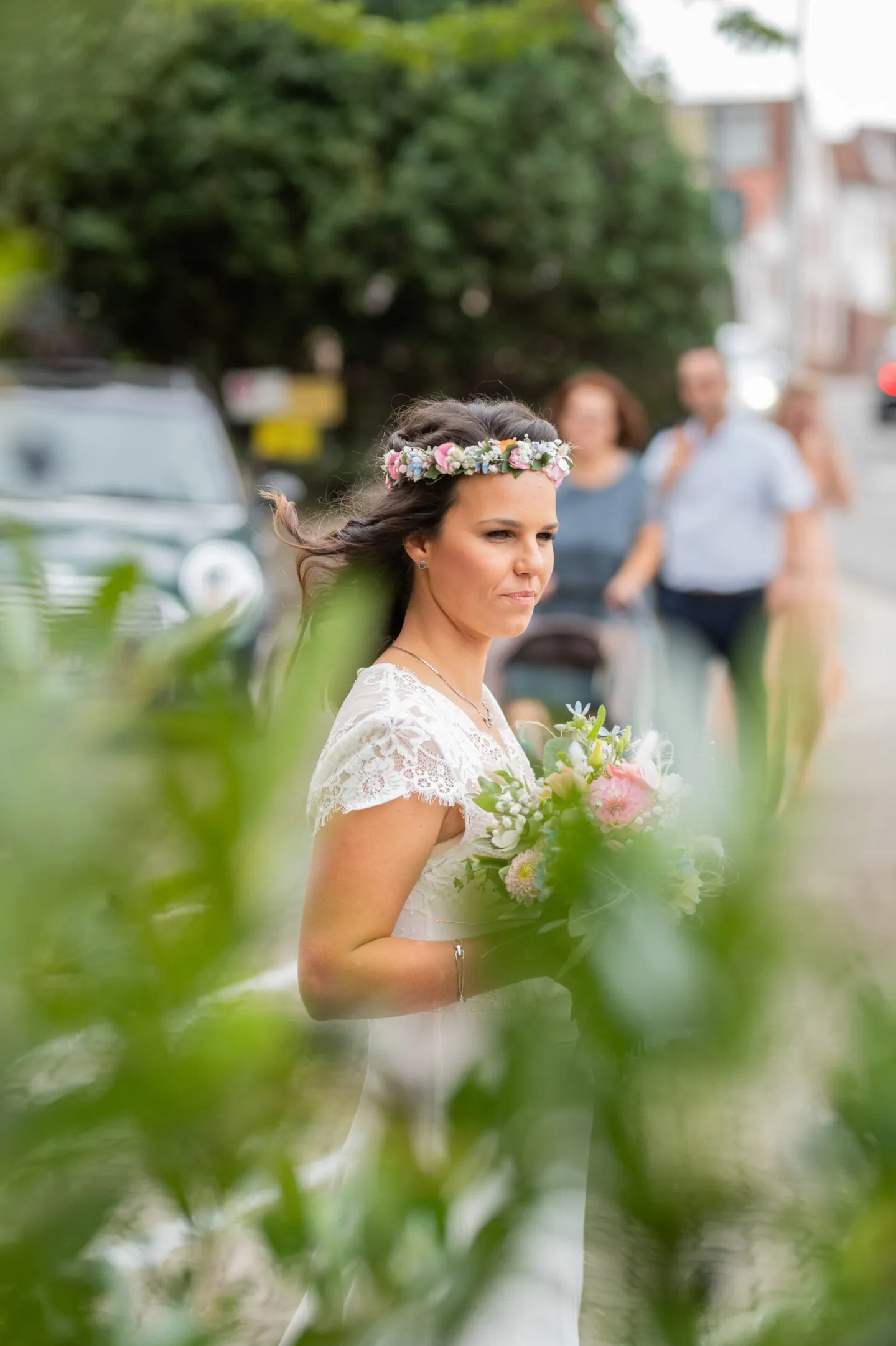 Bride with flower wreath and bouquet