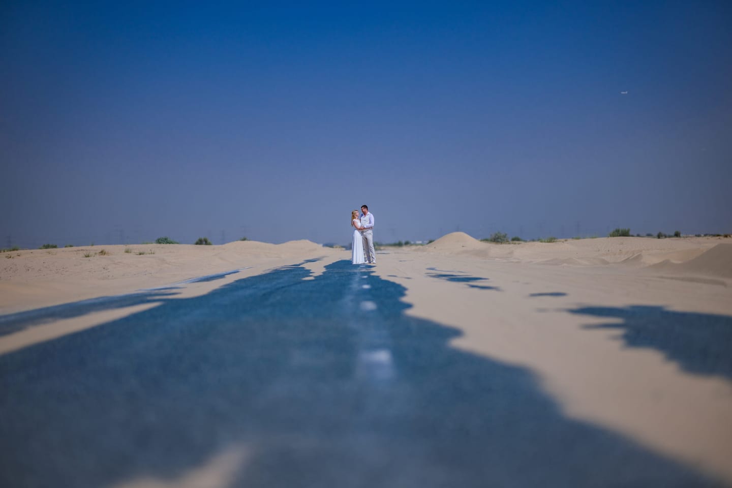 Couple in the desert on a lonely road
