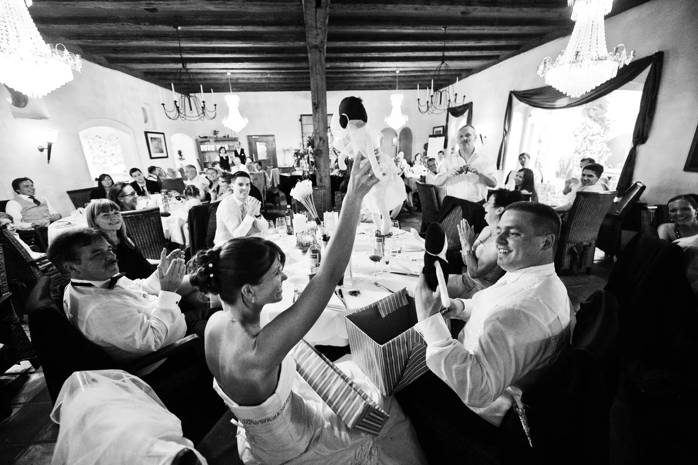 Wedding game in the hall with guests and bridal couple