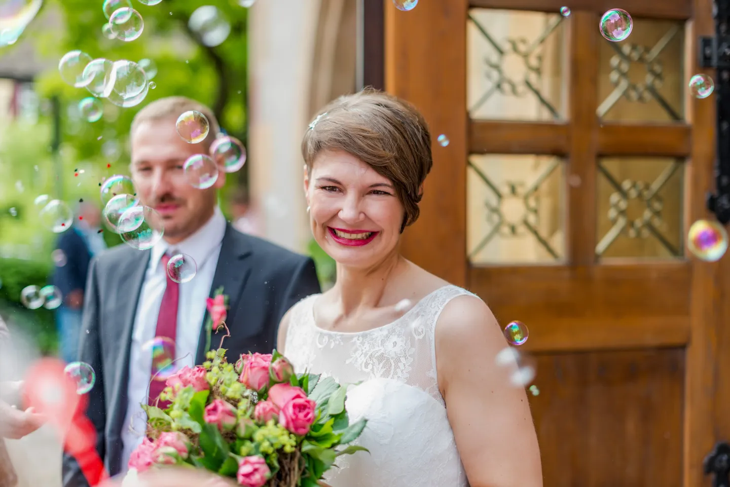 Bride with bouquet and bubbles