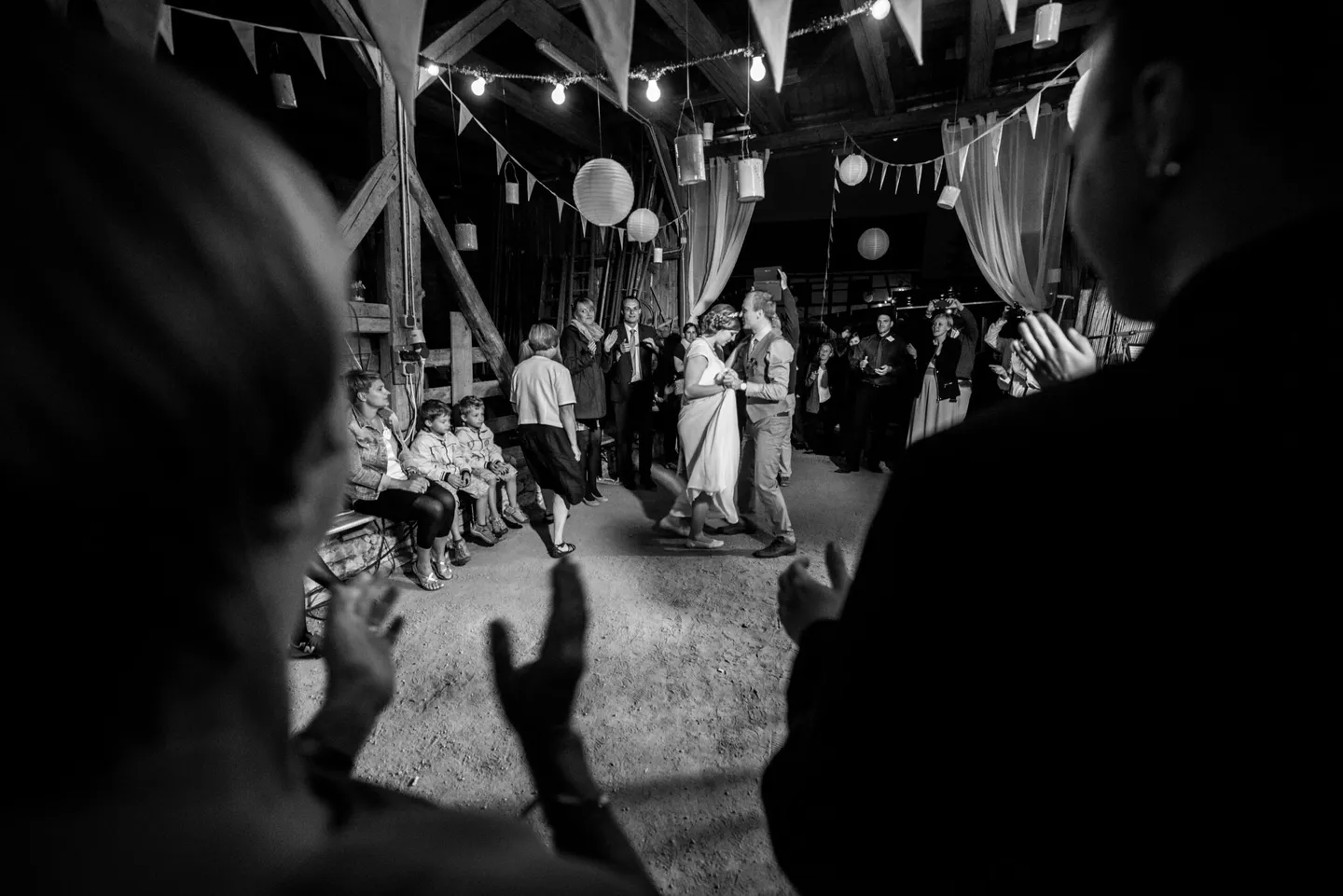 Dancing in a decorated barn, black and white photo
