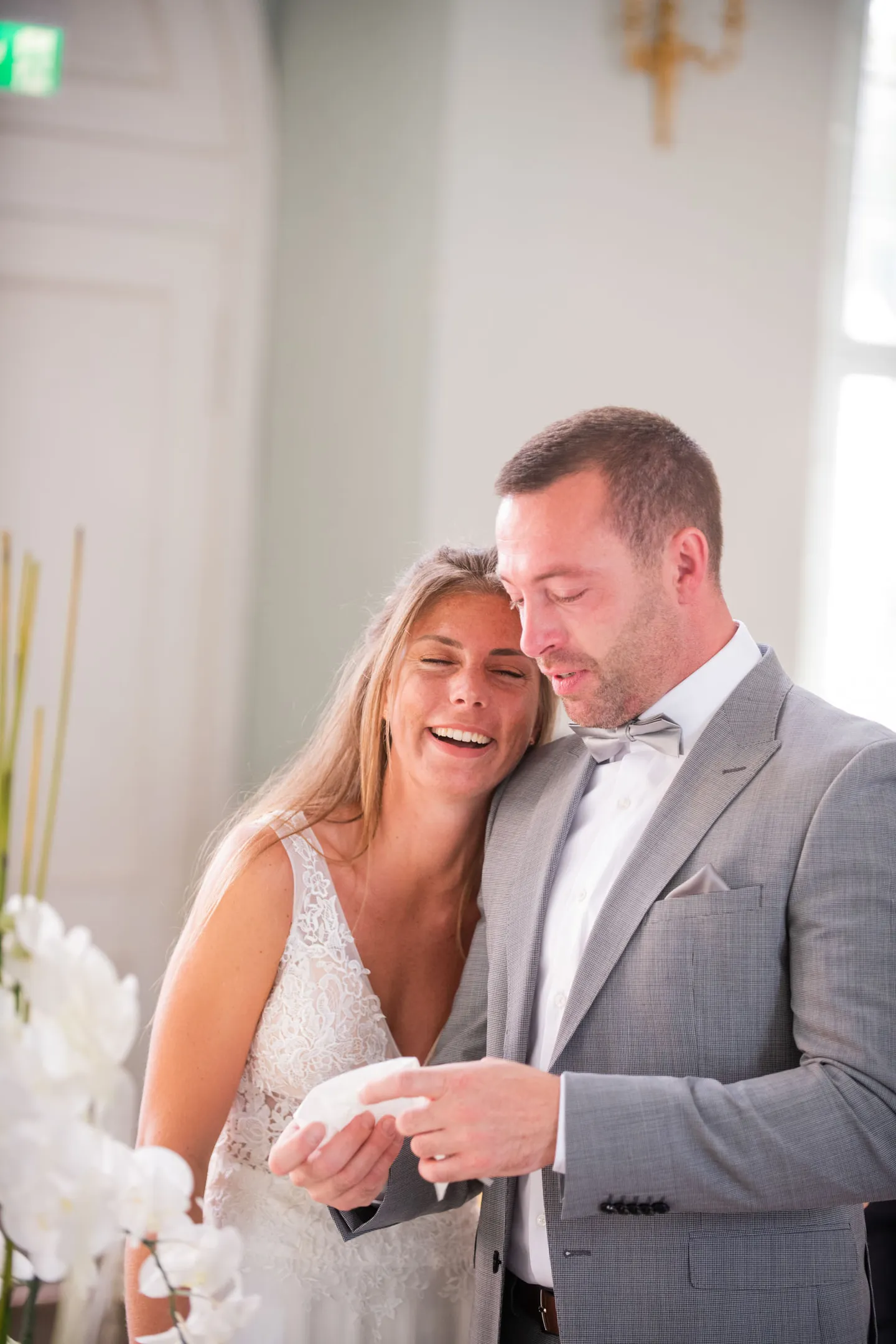 Happy couple at their wedding in a room