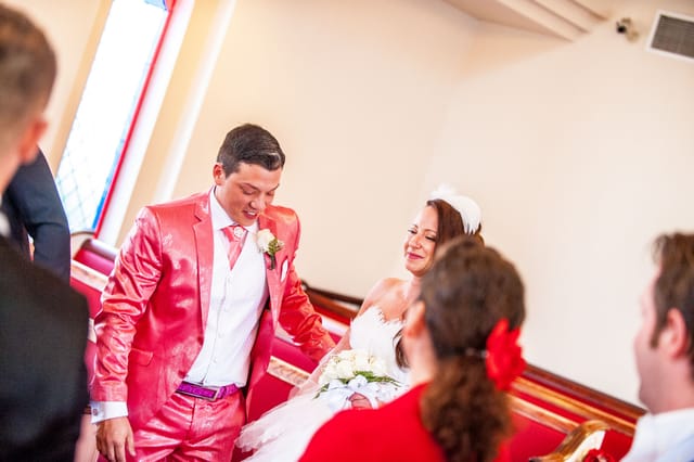 Wedding couple in the church with guests