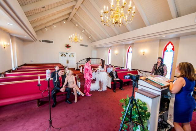 Wedding ceremony in a small church with guests.