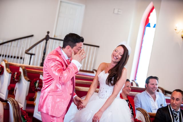 Laughing bride and groom at their wedding in the church.