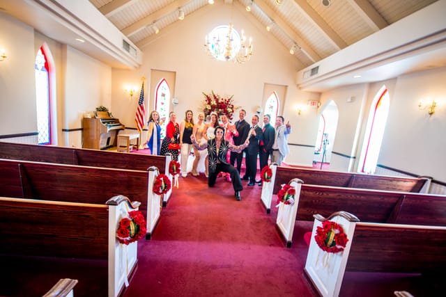 Wedding couple with Elvis impersonator in chapel