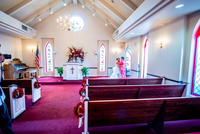 Wedding ceremony in a colorful chapel