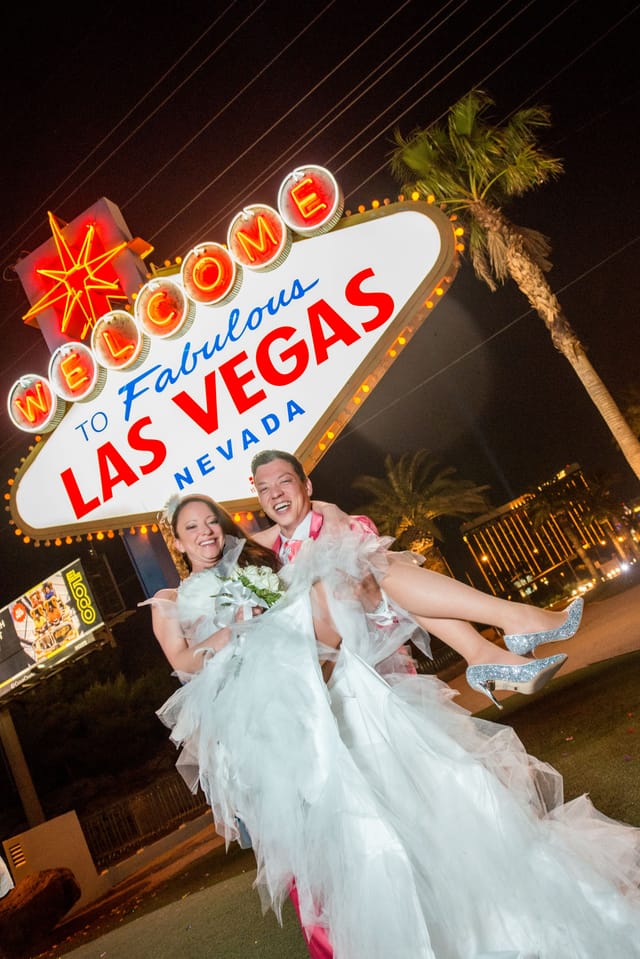 Wedding couple in front of Las Vegas sign