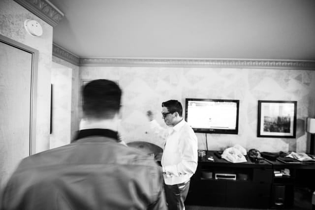 people in a room with a TV and furniture.