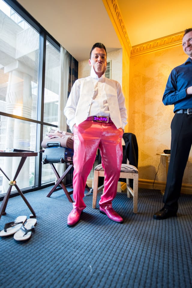 Man with pink suit and white vest