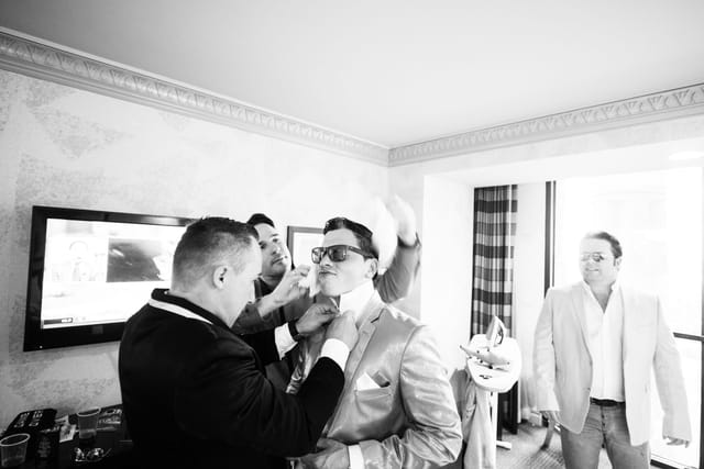 Men prepare for an event.