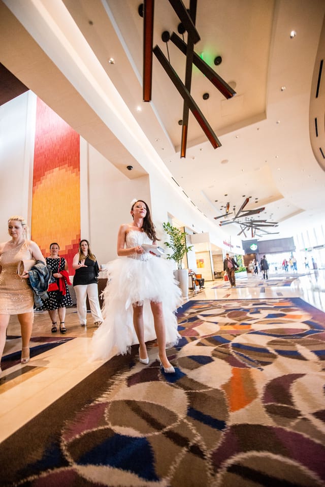 Woman in white dress in hotel lobby